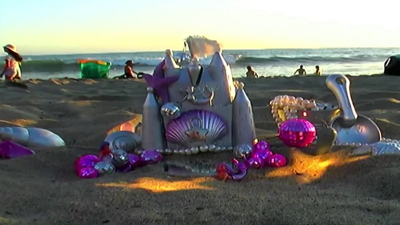A silver beach castle at sunset